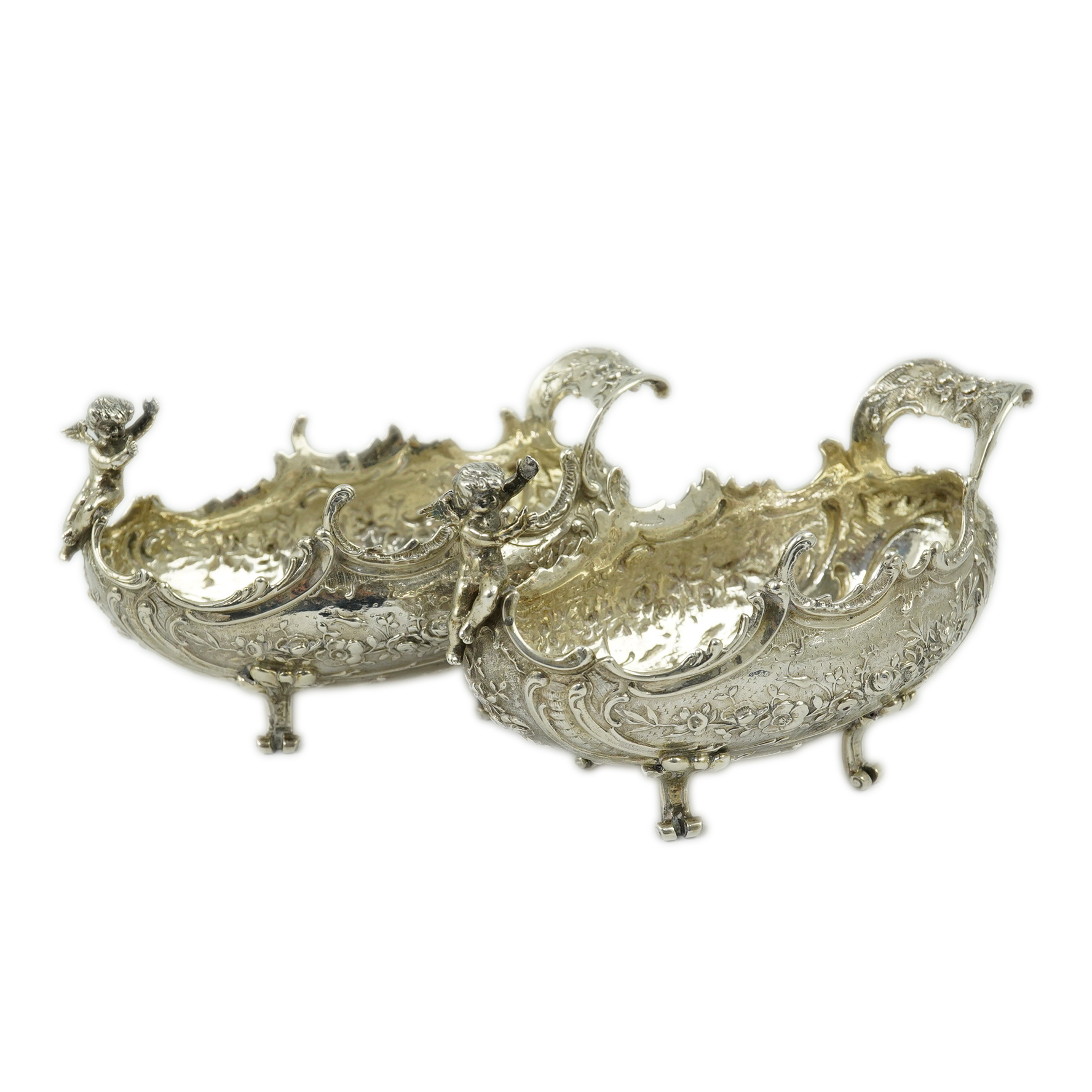 A pair of late 19th century German Hanau ornate embossed silver oval sweetmeat bowls